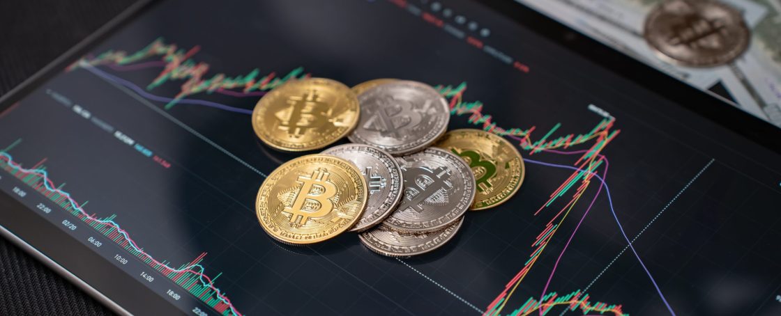 Bitcoin,On,The,Background,Of,Charts,,Green,Screen.bitcoin,Under,Government