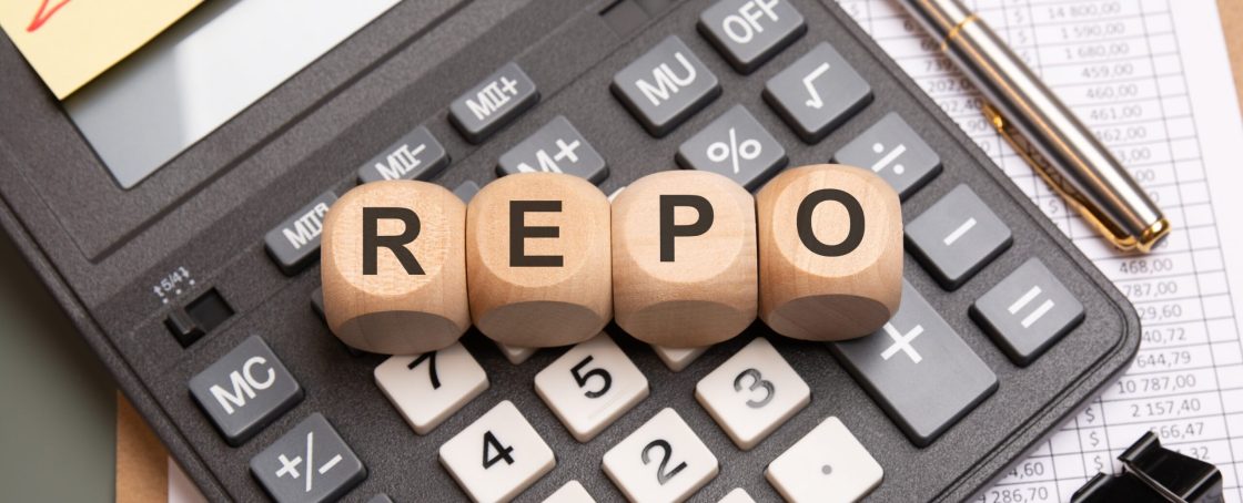 Wooden,Blocks,With,Repo,Text,On,Calculator,,Spreadsheet,,Pen,And